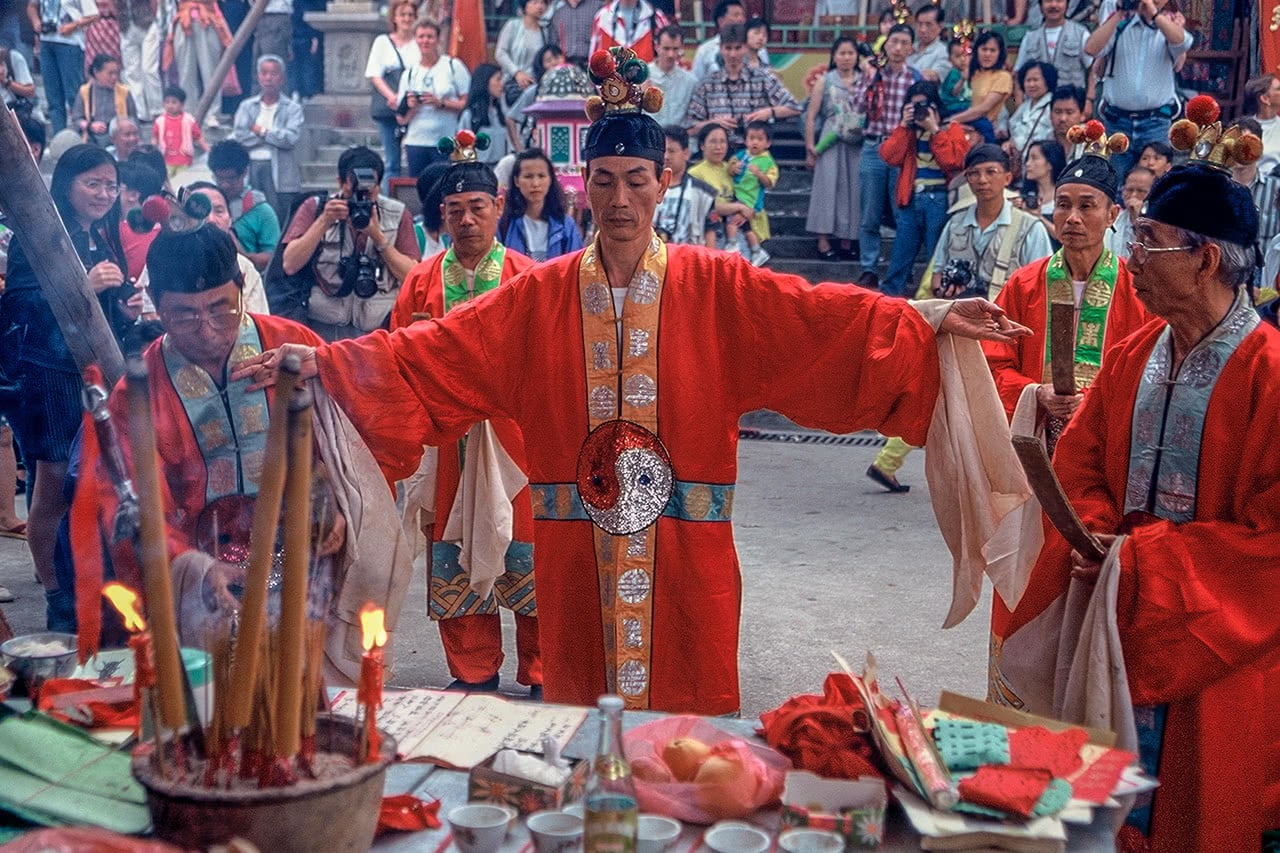A priest performing a ritual at the beginning of the Bun Festival in Cheung Chau, Hong Kong