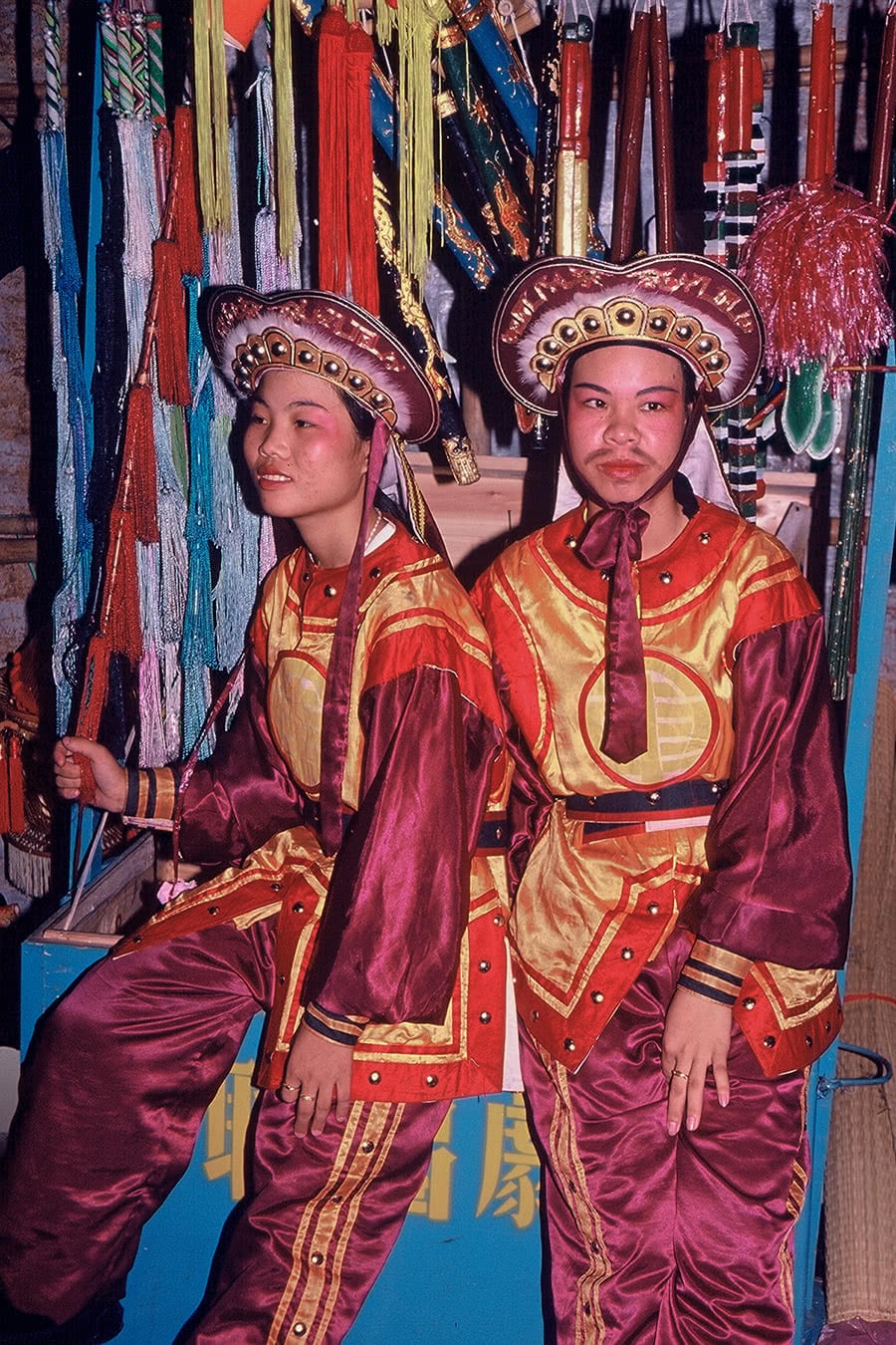 Chinese opera performers taking a break backstage.