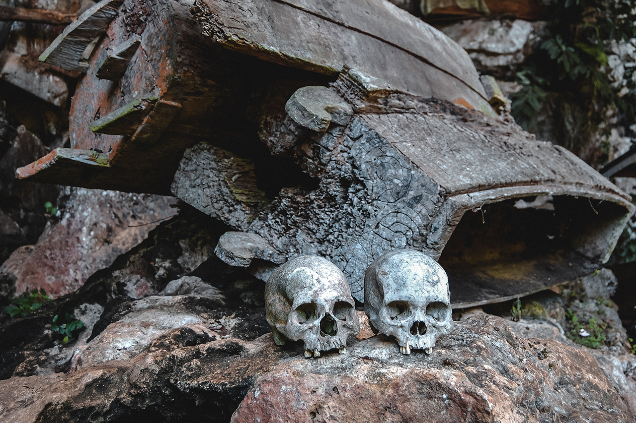 Skulls and bones in a burial chamber in Tana Toraja, Indonesia.