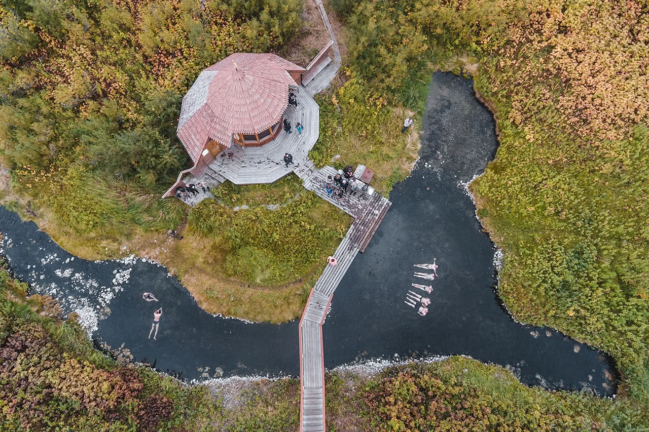 Drone view of bathers in a natural hot spring in Kamchatka.