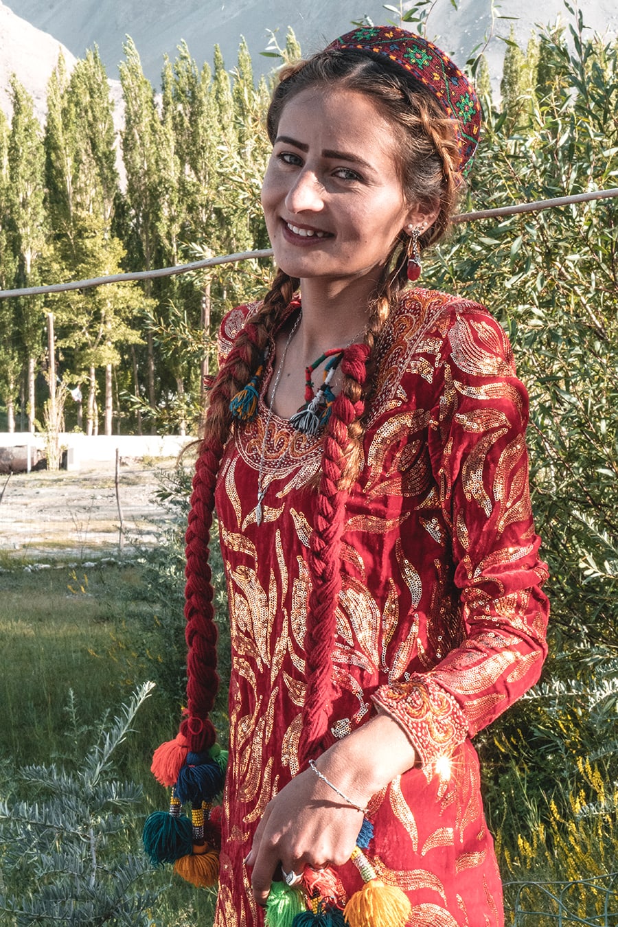 Wakhi woman dressed in tradional dress at a festival near Langar, in the Wakhan Valley.