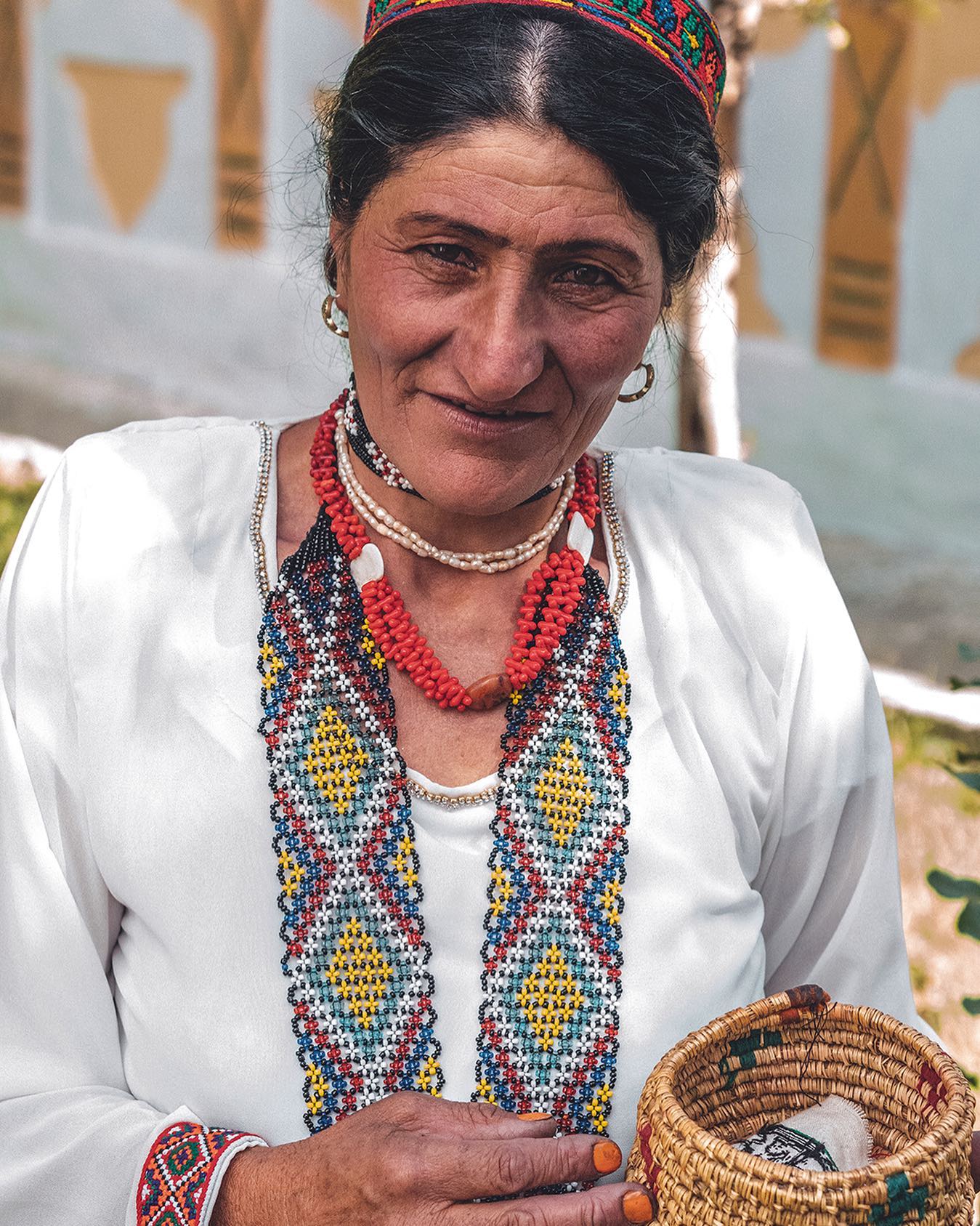 A Wakhi woman in Langar, Tajikistan dressed in traditional clothing for a local festival.