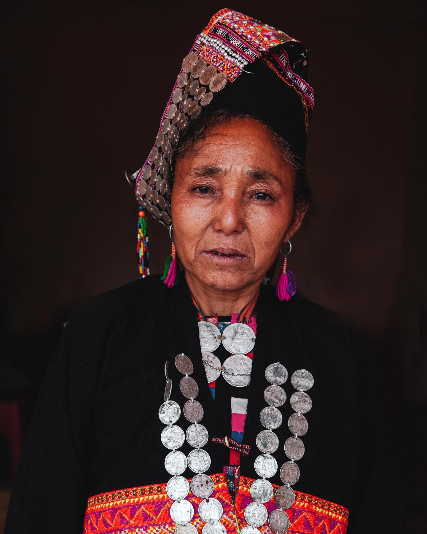 A woman from the Akha Loma minority in Muang La province, Laos.  The villagers here were very unused to seeing foreigners and I was surrounded by curious people the whole time there.